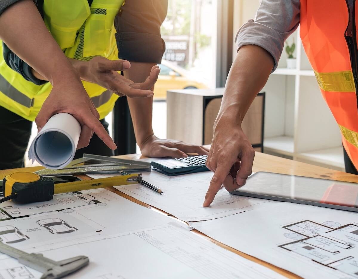 Workers looking at plans